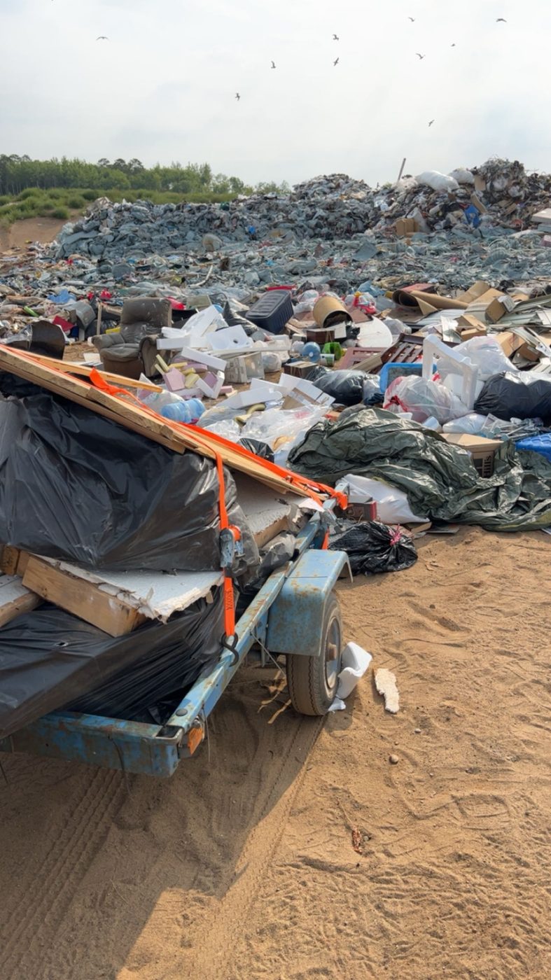 Trailer loaded with demo debris at the landfill