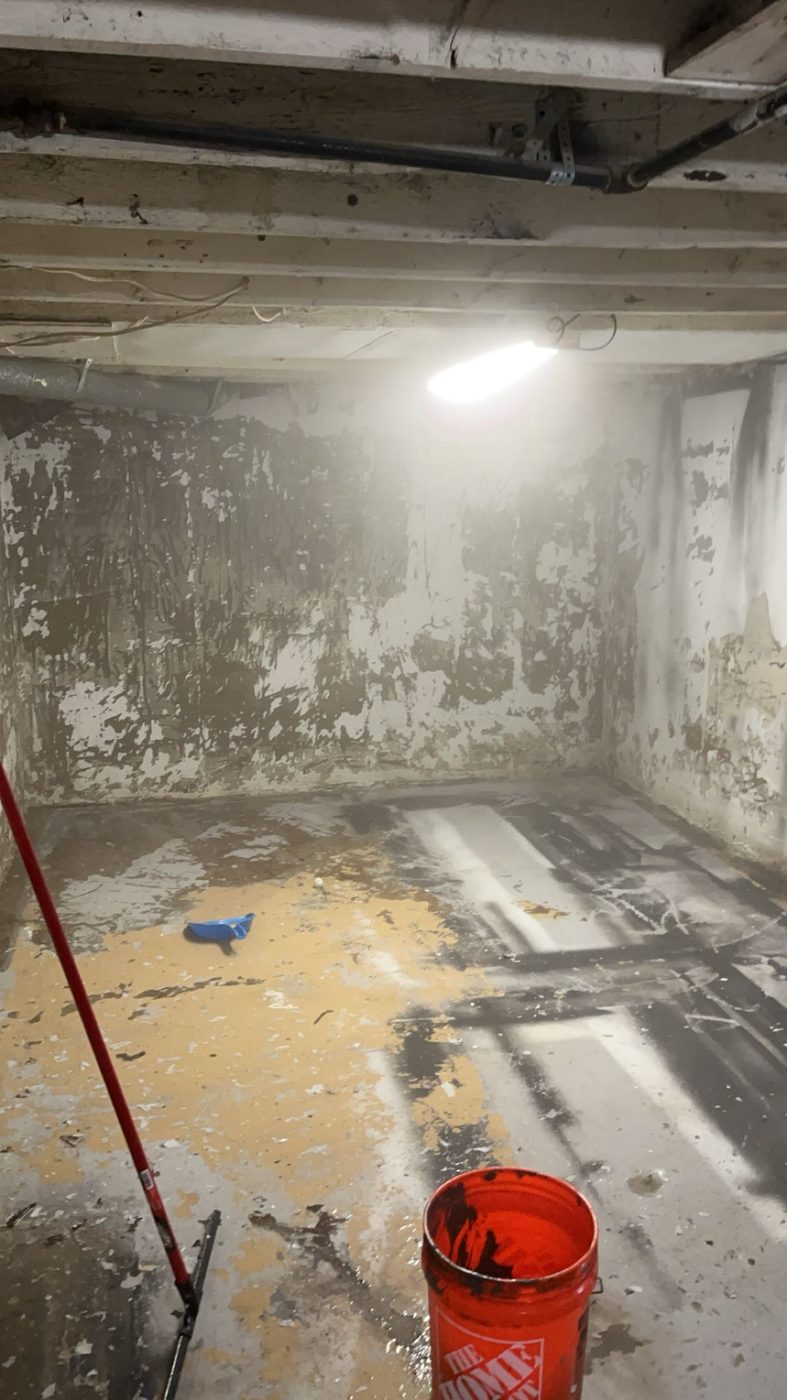 Basement wall stripped down to damaged block during renovation
